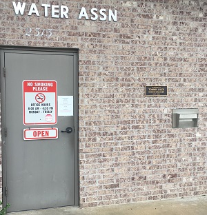 Photo of the side of the SOWCO office building where the night drop slot is located
